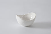 Pampa bay White melamine bowl with textured edge on a light gray background