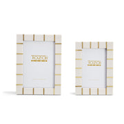 Two photo frames with gold accents on a white background, featuring the brand 'Tozai'.