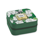 A Toss Designs Brand square green zippered case with a printed lid featuring white flowers, green leaves, and a perfume bottle illustration labeled 'No. 5 PARIS EAU DE PARFUM'.