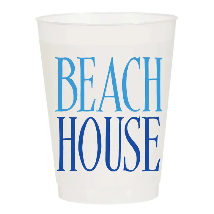 White cup with blue 'BEACH HOUSE' text on a white background