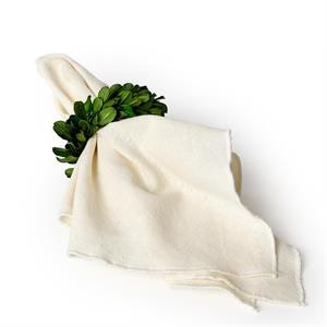 White cloth draped over a bouquet of green flowers on a white background
