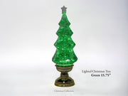 A green glittery water lantern Christmas tree on a decorative gold-colored base, shown against a white background with text overlay indicating 'Lighted Christmas Tree Green 15.75"'.