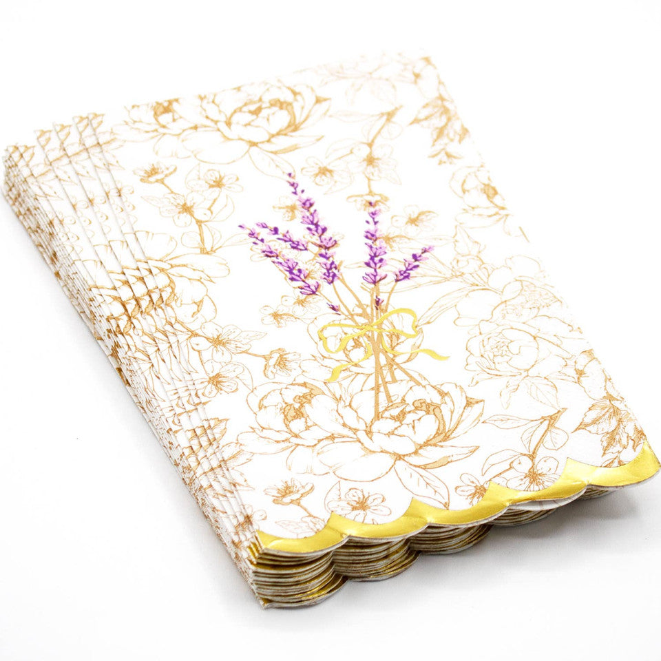 Stack of paper napkins with floral design and lavender decoration on a white background