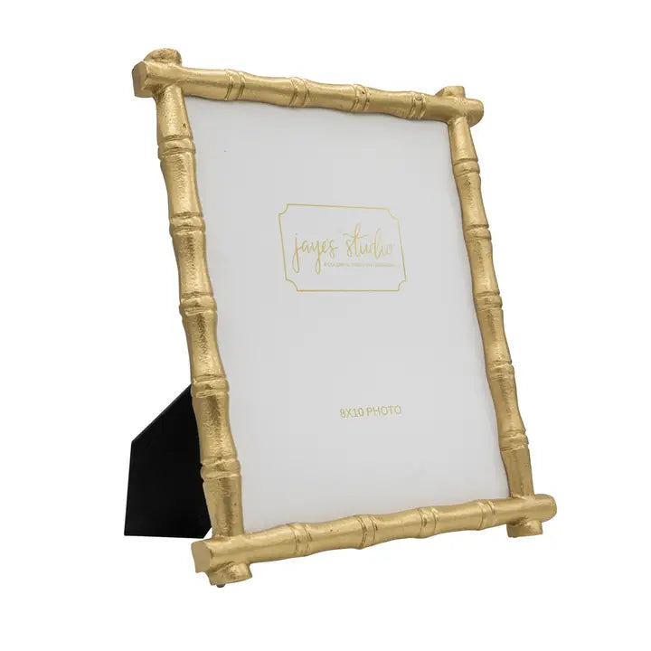 Gold bamboo-style picture frame with a white background