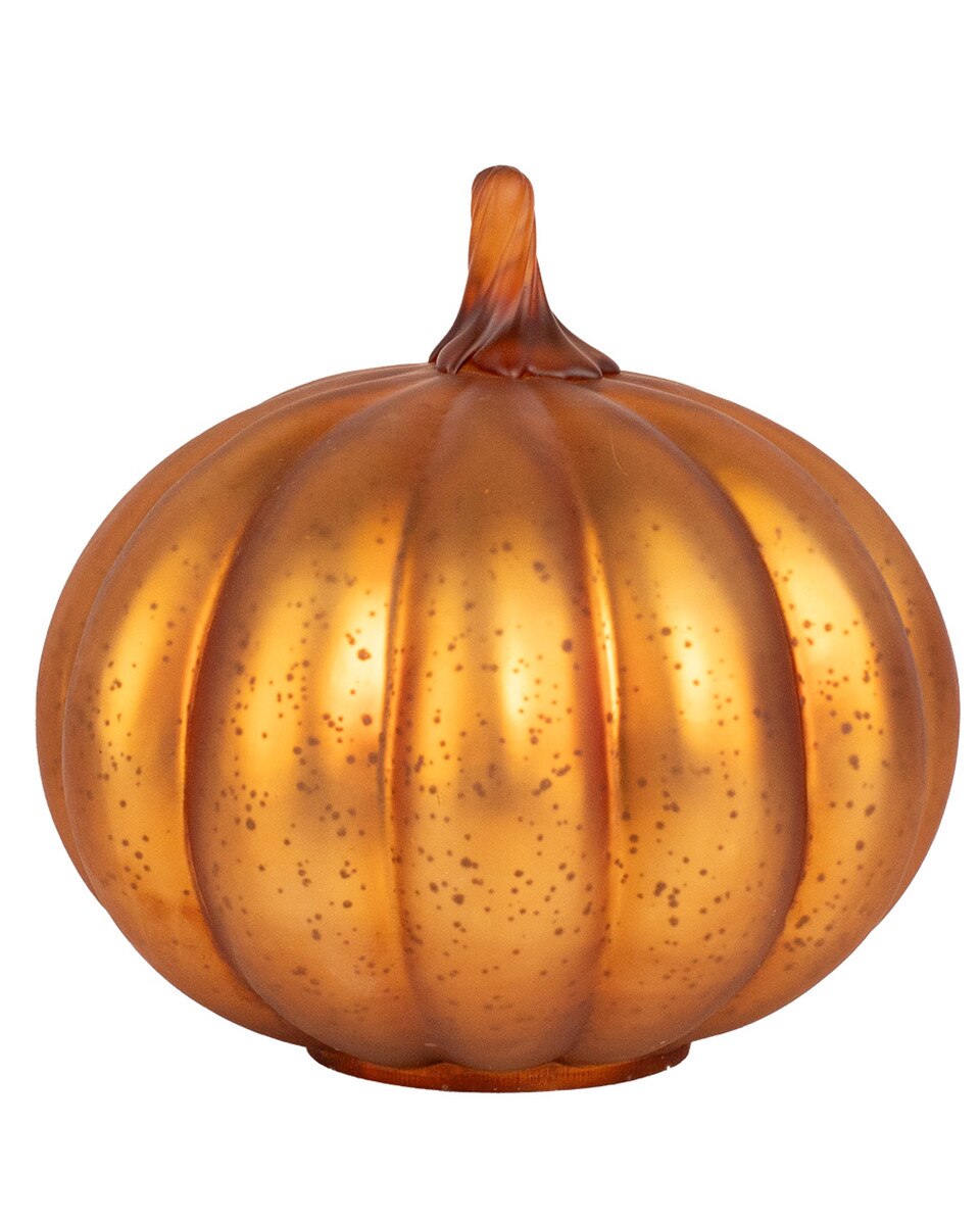 Gold pumpkin decoration on a white background