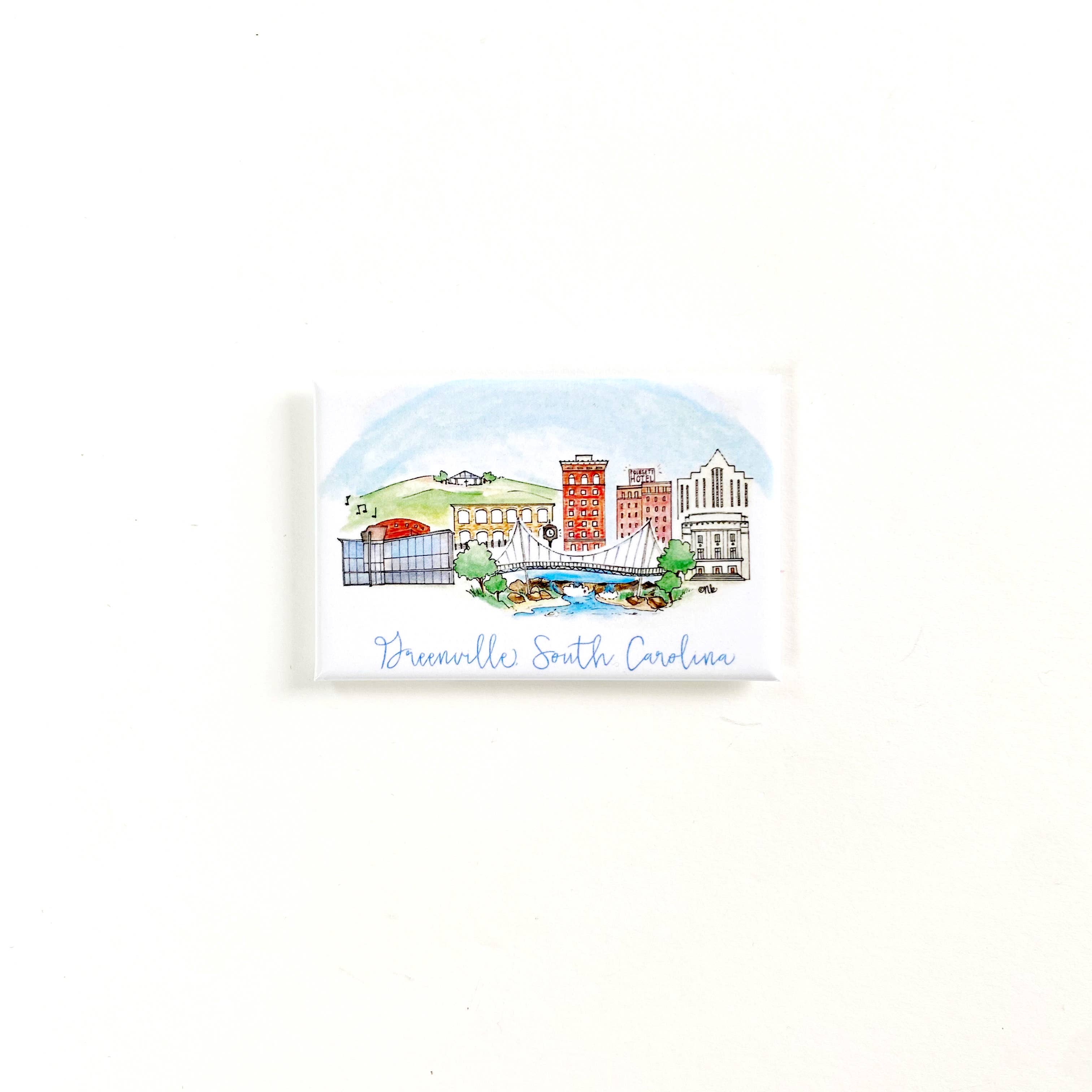 A small rectangular printed card or magnet featuring a watercolor illustration of the Brewhouse in Greensboro, South Carolina, with the text Greenville South Carolina' below, shown on a plain white background.