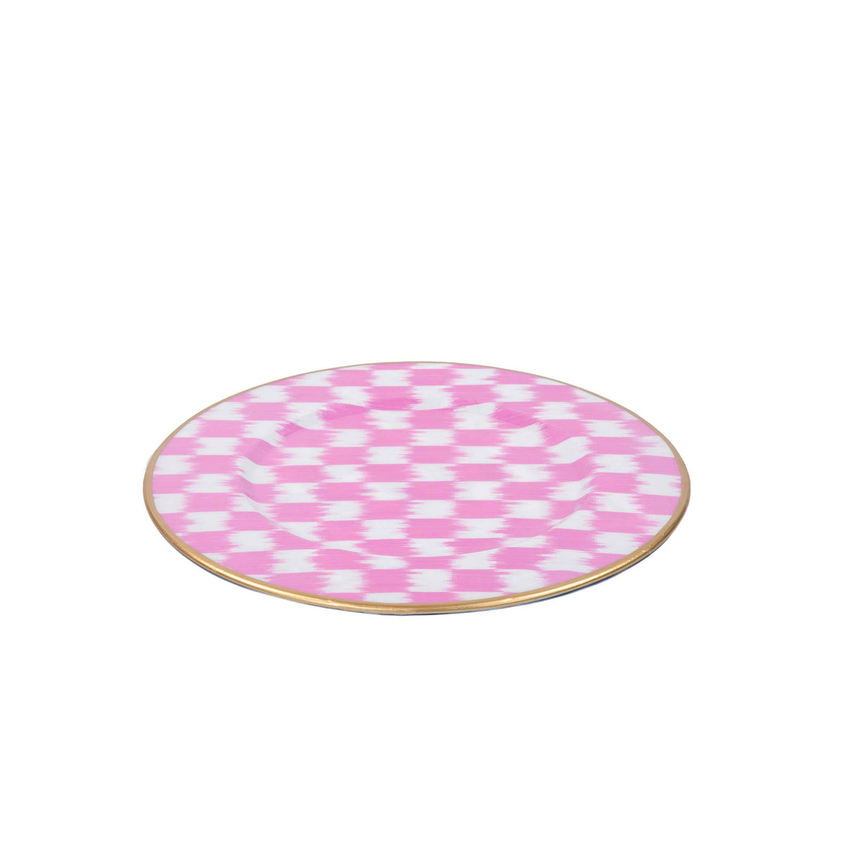 A round charger featuring a pink and white checkerboard ikat pattern with a thin gold rim, shown on a plain white background.
