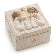 Decorative box with carved figures on a white background