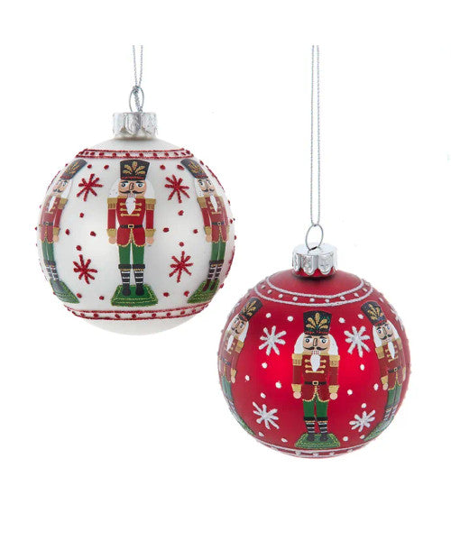 Two Christmas ornaments with nutcracker design on a white background