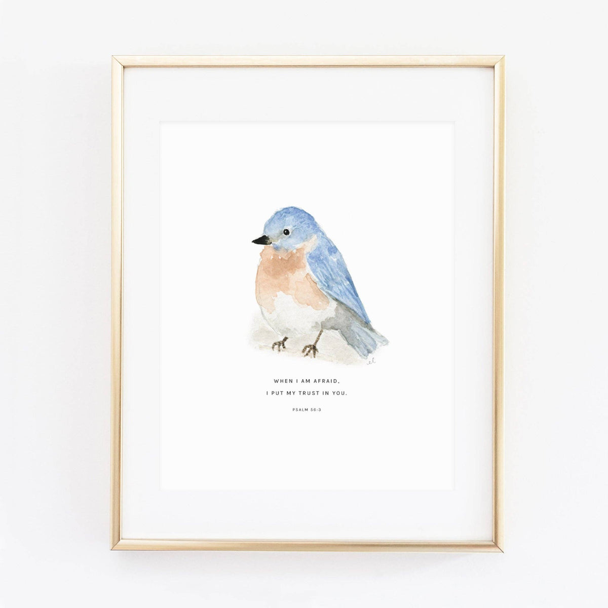 Framed artwork of a blue bird on a white background