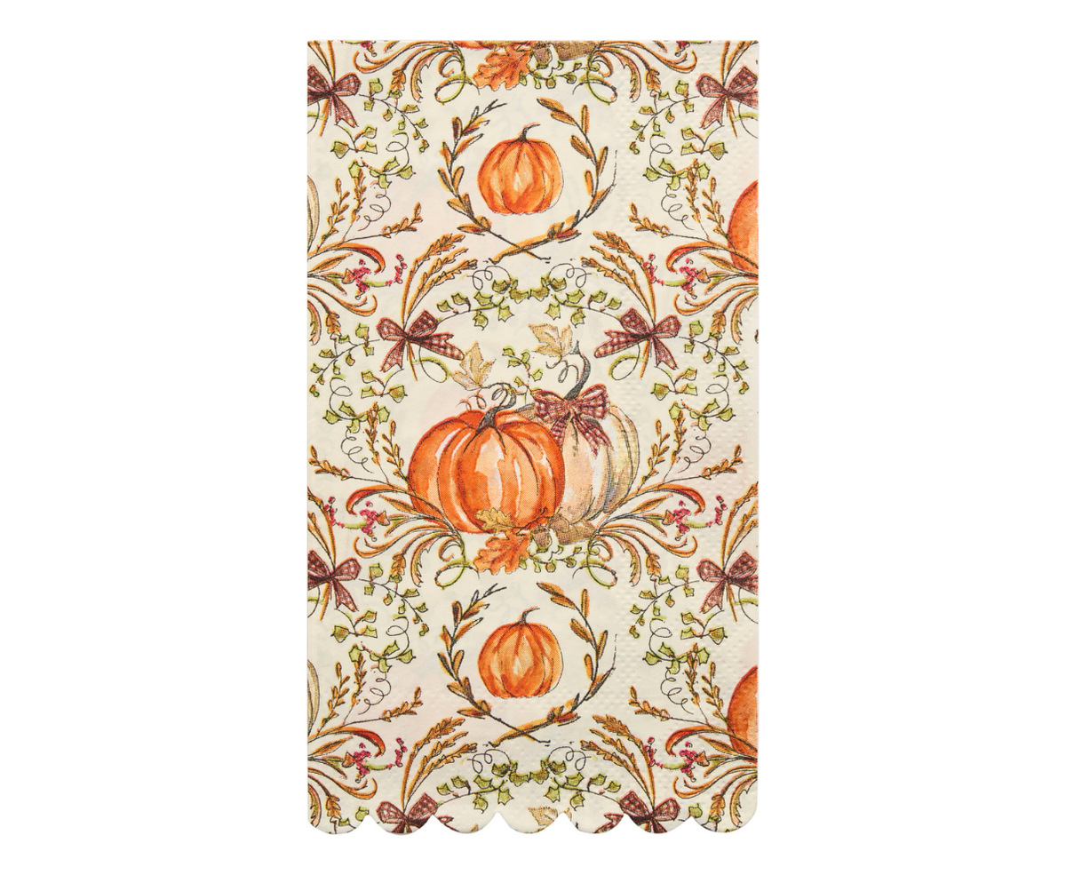 Decorative paper guest or dinner napkin with pumpkins and autumn leaves on a white background