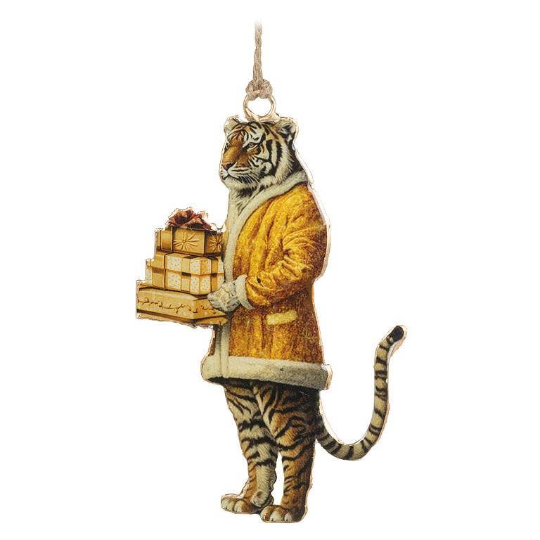 A hanging tiger-shaped ornament or decoration standing on its hind legs, wearing a mustard-yellow coat with cream trim and holding a stack of wrapped presents, shown on a plain white background.