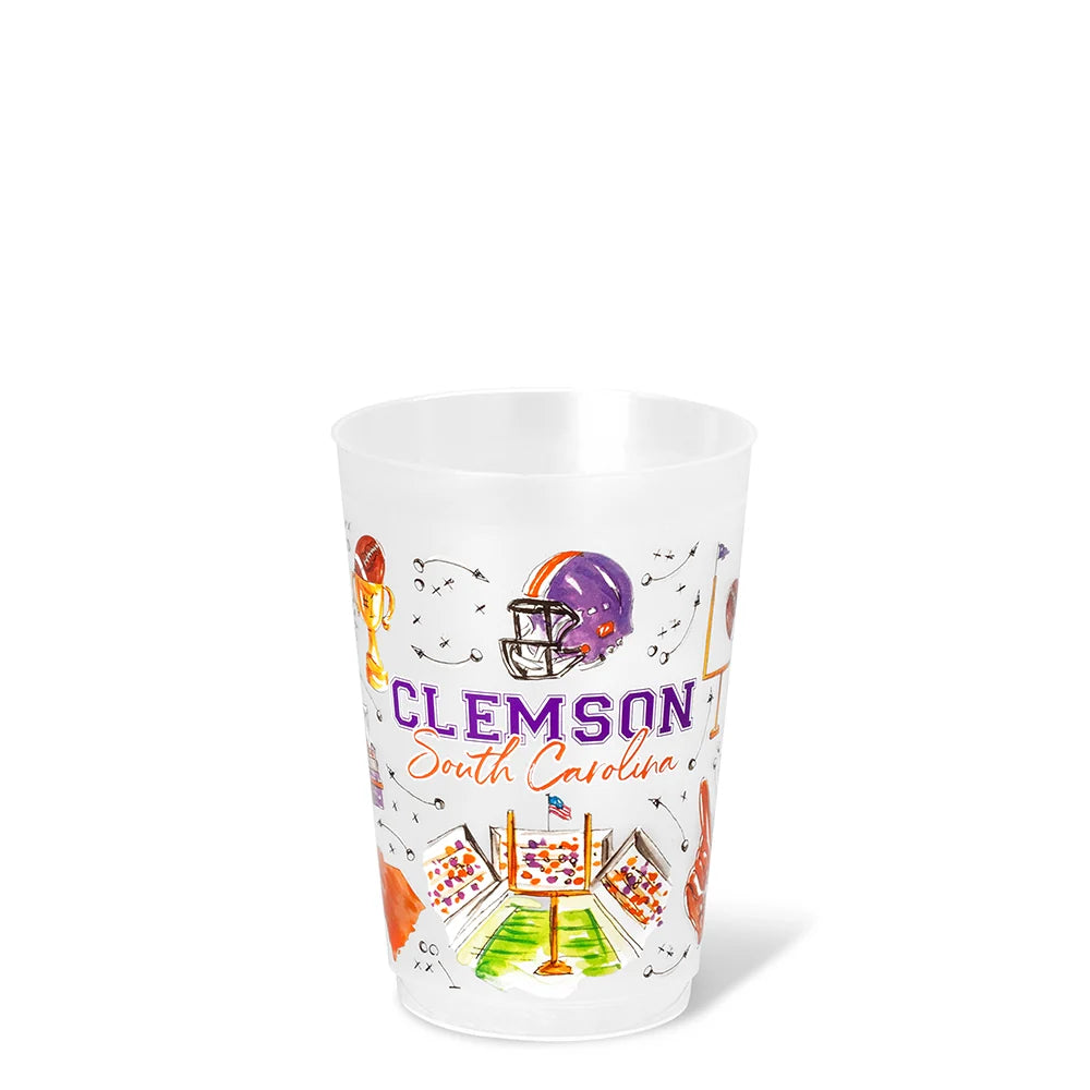 A clear plastic cup featuring a Clemson South Carolina football-themed graphic print with a purple and orange helmet, football field, and 'CLEMSON South Carolina' text, shown on a white background.
