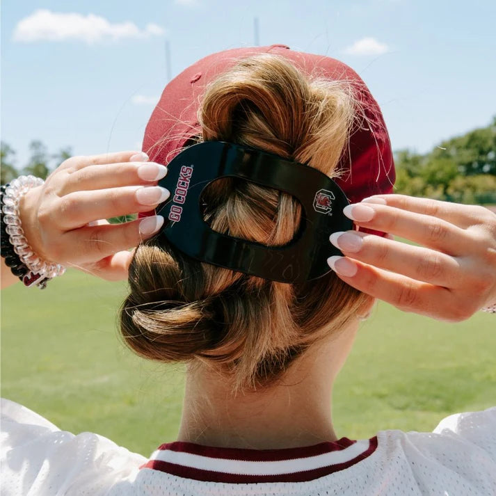 black go cocks hairclip being worn by woman