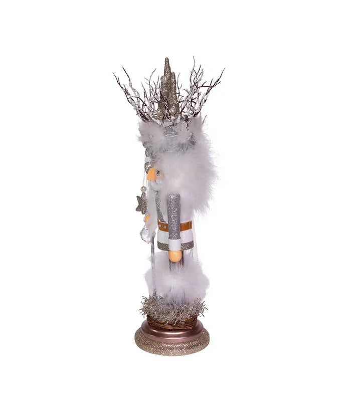 Decorative figure with a white fur-like texture and branch-like top on a white background