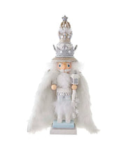 Decorative figure of a nutcracker with a silver crown and white outfit on a white background