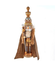 Decorative figure of a king with a crown, robe, and scepter on a white background
