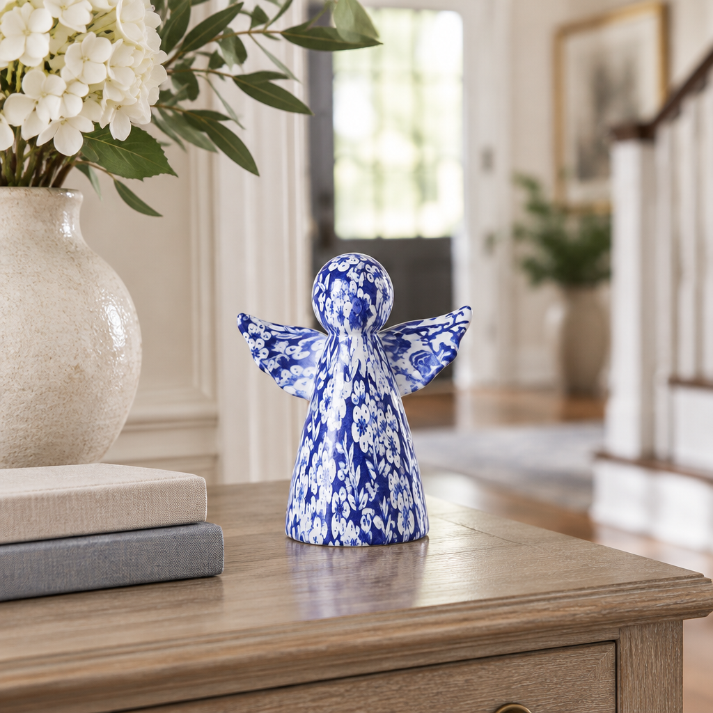 Chinoiserie angel decor displayed on an elegant entryway console table