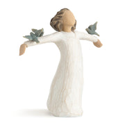 Decorative figurine of a woman with outstretched arms holding birds on a white background