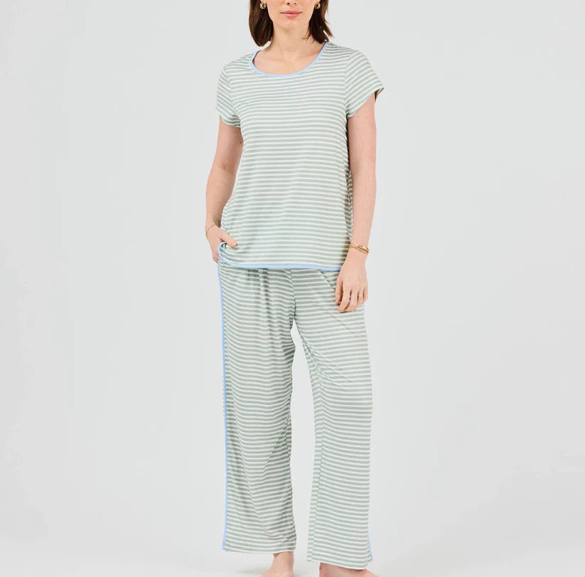Woman wearing a striped t-shirt and pants on a white background