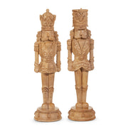 Two ornate wooden nutcrackers on a white background