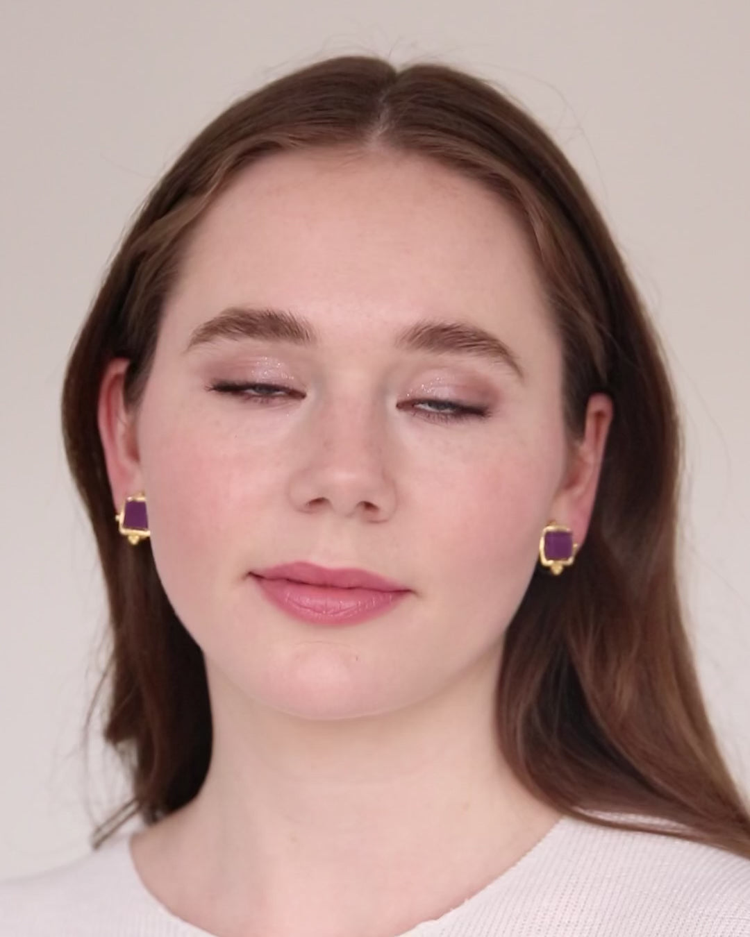Load video: video of woman wearing Susan Shaw purple Charlotte style stud earrings