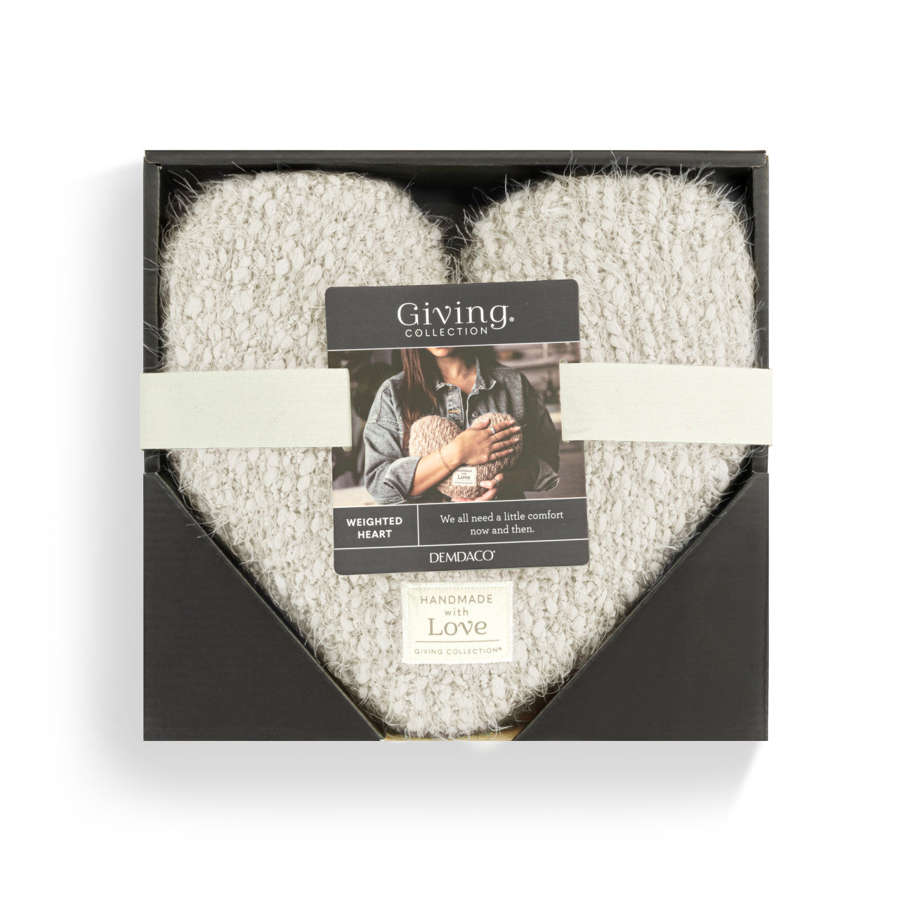 White plush blanket in a black box with 'Giving Collection' label on a white background