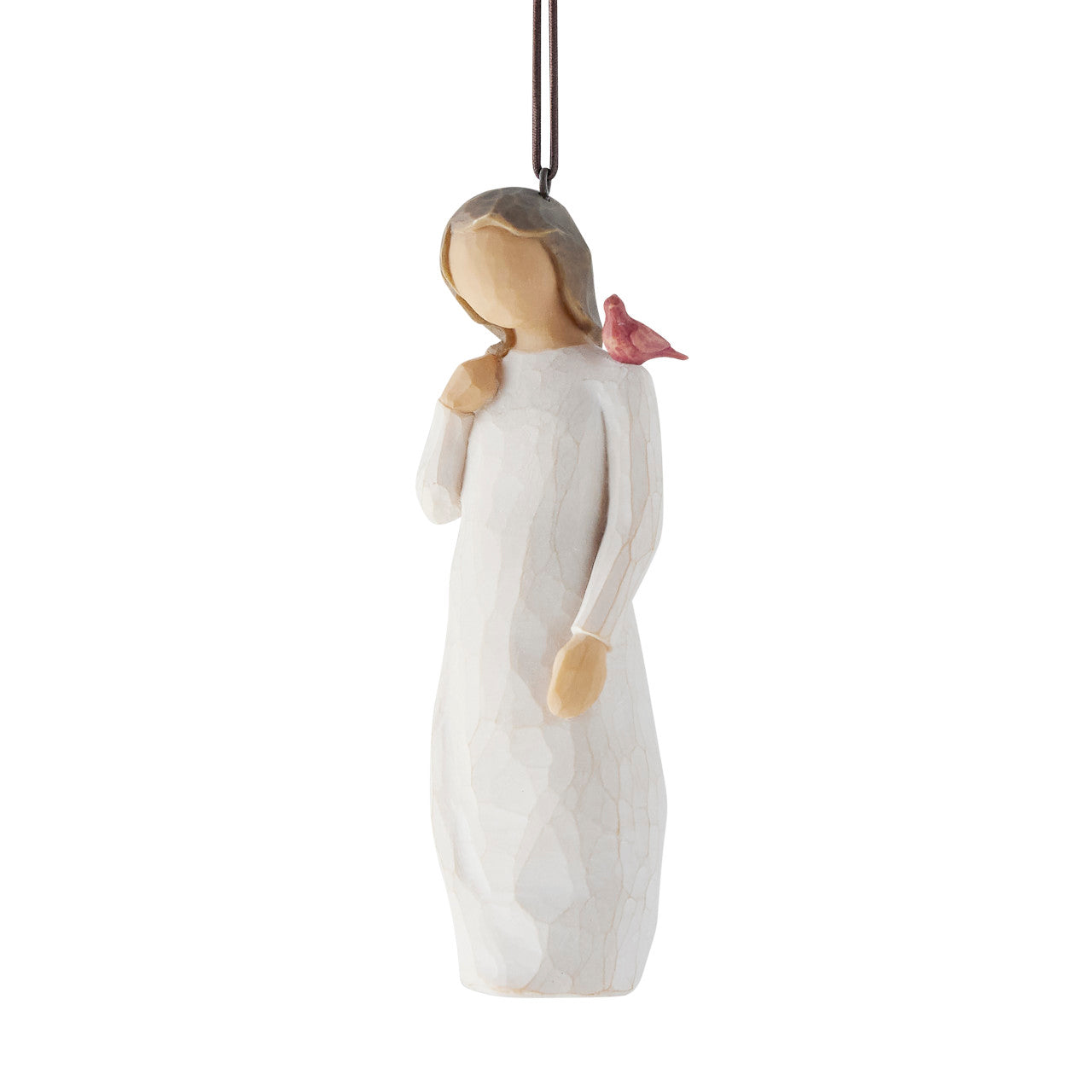 Decorative figurine of a woman in a white dress with a bird on her shoulder against a white background