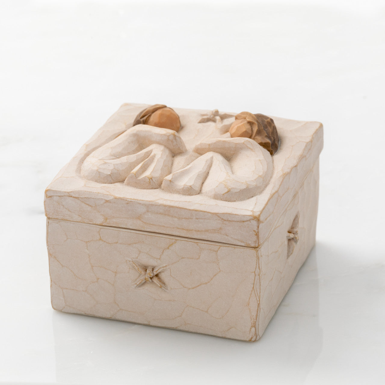 Decorative box with crumpled paper texture and star design on a white background