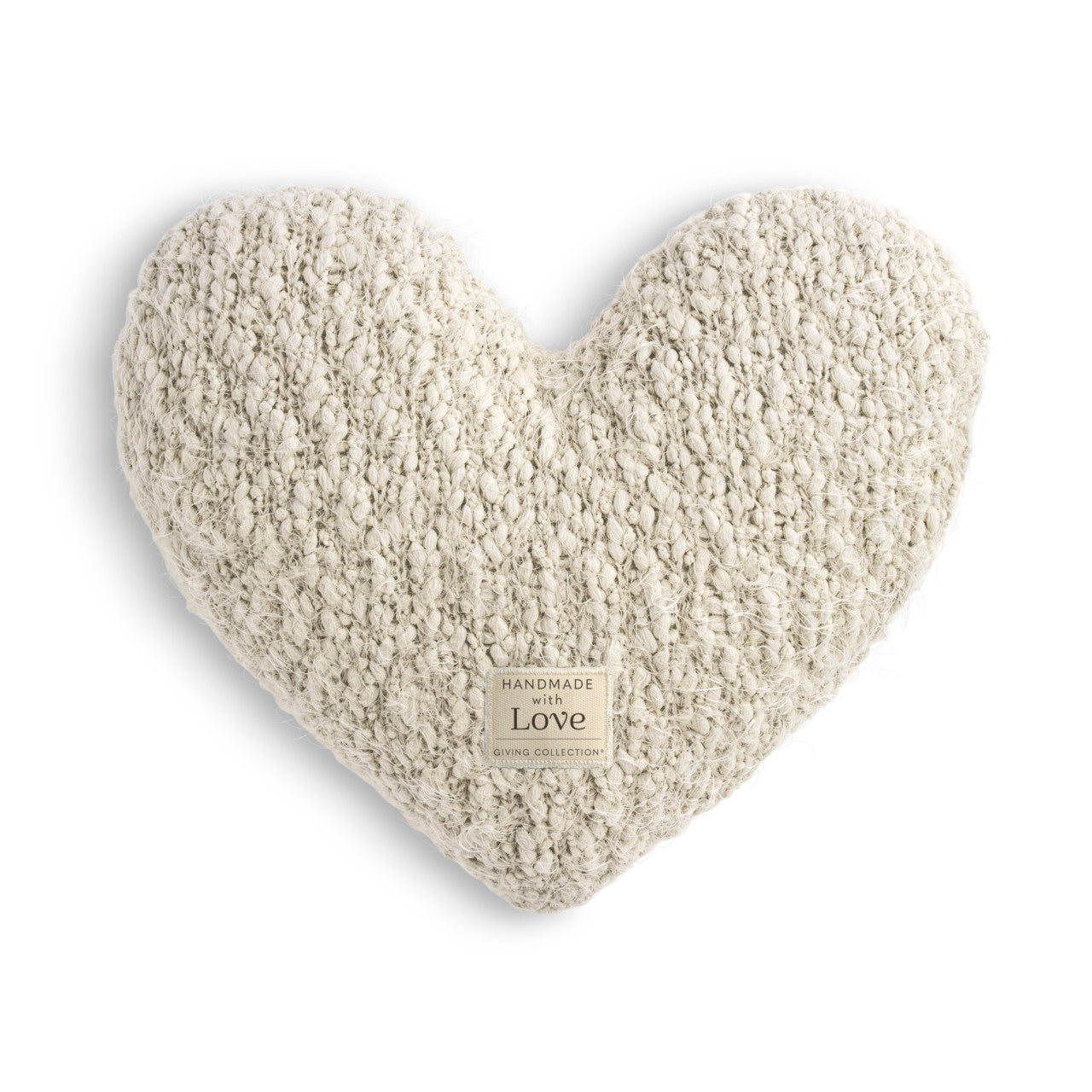 Heart-shaped pillow with textured surface on a white background